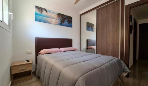 Postel nebo postele na pokoji v ubytování Apartamento con Piscina