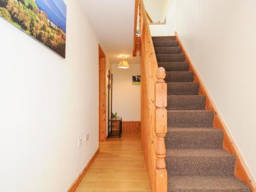 a staircase in a home with white walls and wooden floors at Treview in Launceston
