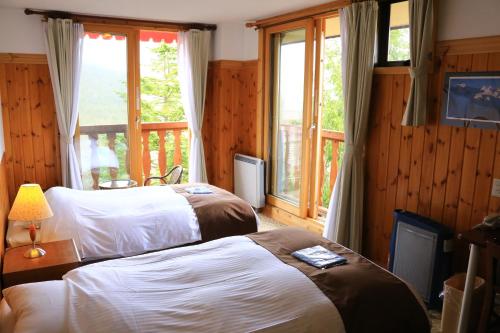 Postel nebo postele na pokoji v ubytování Hotel Andermatt