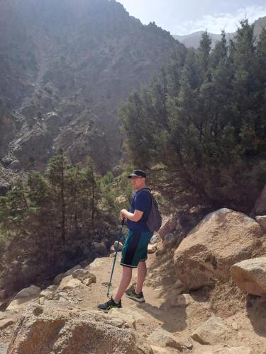 a man standing on top of a mountain at Tazart Lodge in Marrakech