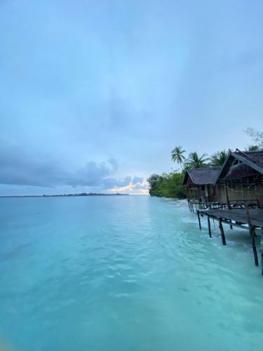 a view of a body of water with houses at Fam Homestay in Fam