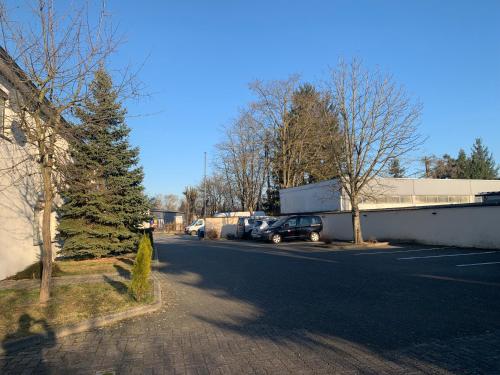 a street with a car parked in a parking lot at Turm Hotel Hanau in Hanau am Main