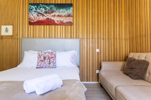 a hotel room with a bed and a couch at Holiday Home Funchal Center in Funchal