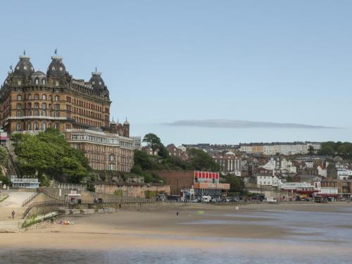 a view of a beach with a large building at The Newborough - 1 Bedroom Apartment in Scarborough