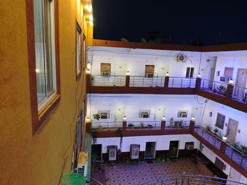an overhead view of a balcony of a building at night at Raj Hotel - Since 1960 in Sultānpur