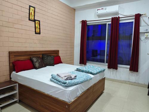 a bedroom with a bed in a room at Raj Hotel - Since 1960 in Sultānpur