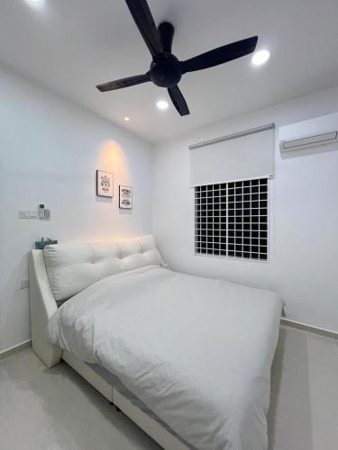 a white bedroom with a bed and a ceiling fan at BungalowD Pool Villa 7R6B with Netflix Great Movies & Dramas in Ipoh