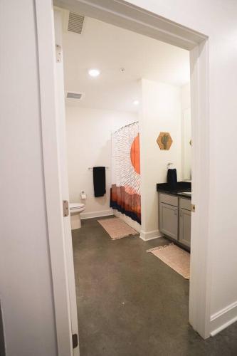 a room with a bathroom with a sink and a toilet at Canyon Stop in Lawrence