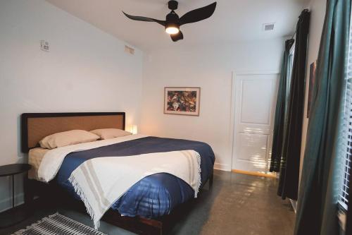 a bedroom with a bed and a ceiling fan at Canyon Stop in Lawrence