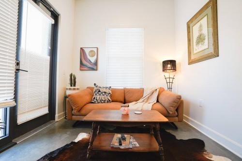 a living room with a couch and a coffee table at Canyon Stop in Lawrence