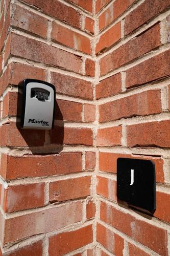 a meter on the side of a brick wall at Canyon Stop in Lawrence