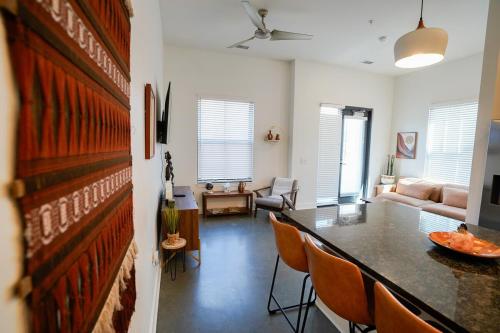 a living room with a table and chairs at Canyon Stop in Lawrence