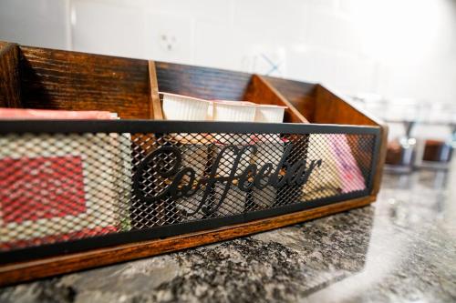a wooden drawer filled with items on top of a counter at Canyon Stop in Lawrence
