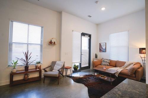 a living room with a couch and a chair at Canyon Stop in Lawrence
