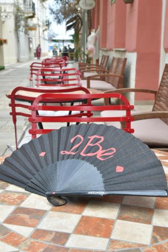 a black umbrella sitting on top of a table at Pension 2Be in Nafplio
