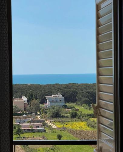 a view of the ocean from a window at Bellavista Villa in Durrës