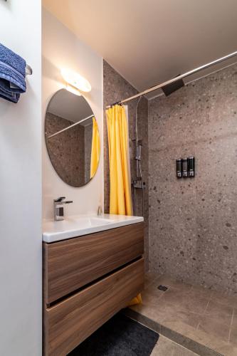 a bathroom with a sink and a mirror at Beachfront Condo with Balcony amazing view in Tijuana