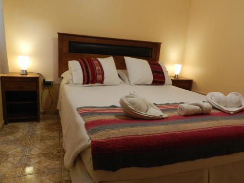 Cama o camas de una habitación en Hostal Illari
