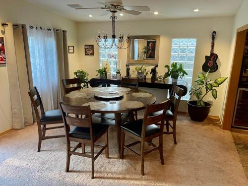 a dining room with a table and chairs at Cheerful Single Story 3-bedroom home w pool table in Santa Clarita