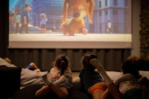 a group of people watching a television show at Hotel ZAWRAT Ski Resort & Spa in Białka Tatrzanska