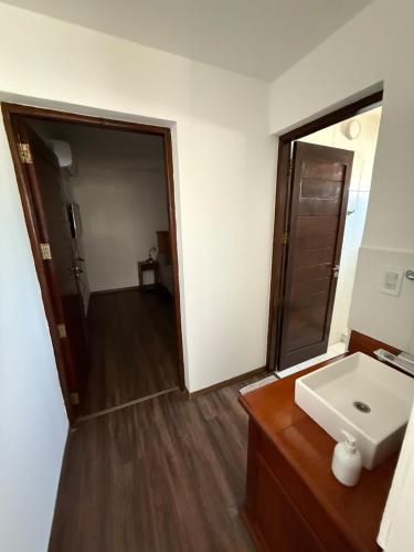a bathroom with a sink and a mirror at Depto Allende in Cordoba