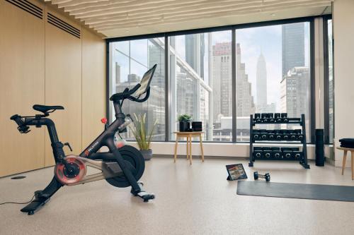 a gym with a exercise bike in a room with a large window at Staybridge Suites Houston West - Energy Corridor by IHG in Houston