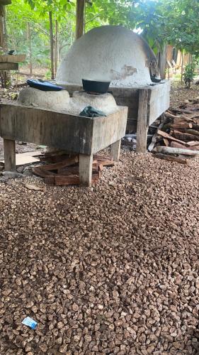 a stone oven with bowls on top of it at Finca Avellanas in Playa Avellana