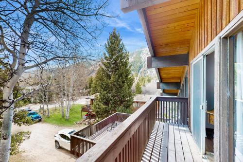 a balcony of a house with a view of the mountains at Mountain Valley Hideaway in Aspen