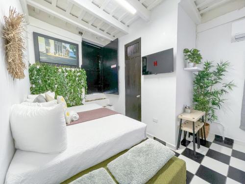 a bedroom with a bed and a checkered floor at Old San Juan Rentals in San Juan
