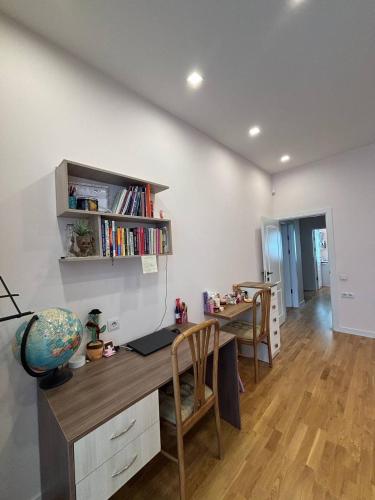 a room with a desk with a book shelf at LoveArmenia in Arrinj