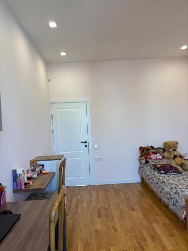 a room with a bed with teddy bears on it at LoveArmenia in Arrinj