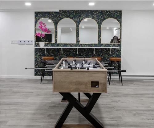a chess game on a table in a room with chairs at Riverfront Retreat in Wareham in Wareham