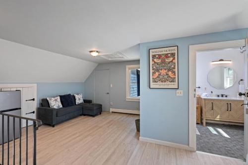 a living room with a couch and a table at Riverfront Retreat in Wareham in Wareham