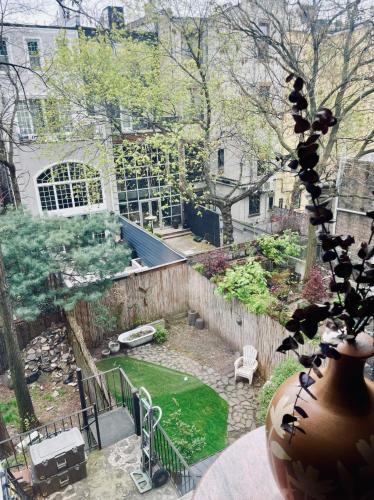 a view of a backyard with a garden at NYC Townhouse Apartment in New York
