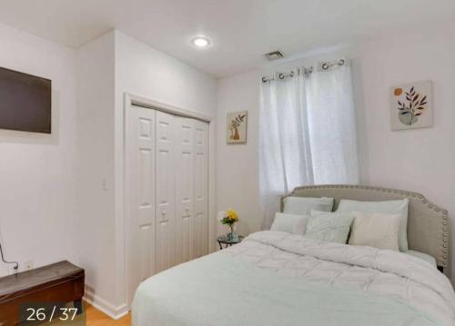 a bedroom with a large bed and a television at 538) Massive 2 bedroom sleeps 12 in Harrisburg