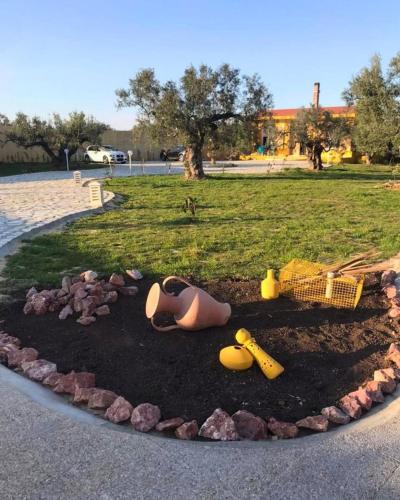 a circle of dirt with toys in a park at Villa l'Olivier d'Or, Un havre de nature, à deux pas de la mer in Akouda