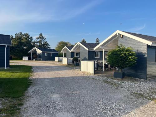 a row of houses parked in a driveway at Storebælt camping in Korsør