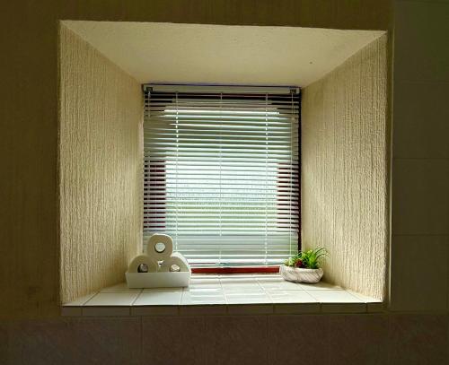 a window with a window sill with a window blind at Modern Rooms with SELF Check-In The Castle, Coldstream in Coldstream