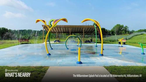 a splash park with a playground with a water slide at Lovely 3br Apartment for 7 - Near Ark Encounter in Williamstown