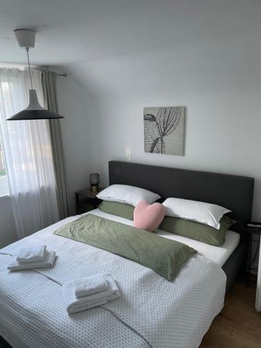 a bedroom with a bed with two towels on it at İnci in Hamburg