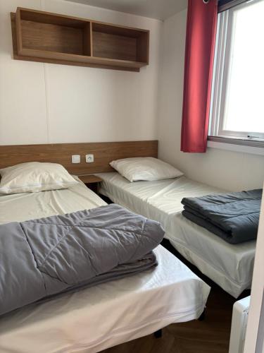 Postel nebo postele na pokoji v ubytování M H 3 Chambres