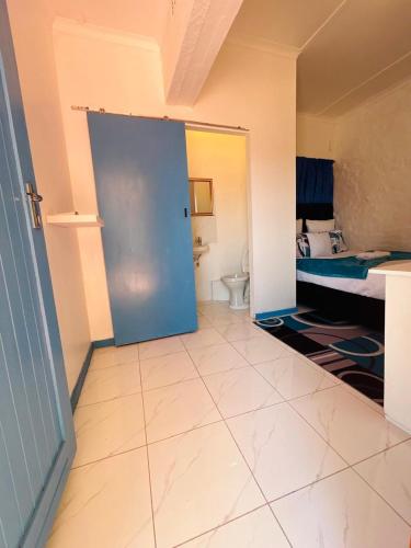 an open door to a bathroom with a toilet at Executive Accommodation Bellville 2 in Cape Town