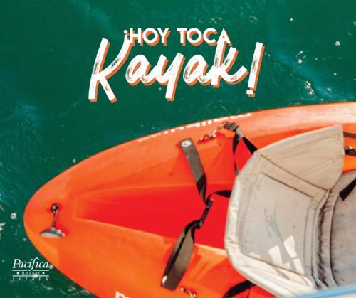an orange kayak sitting on top of the water at Pacifica Resort Ixtapa in Ixtapa