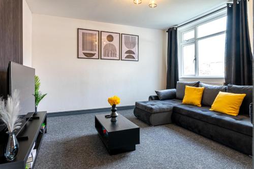a living room with a couch and a tv at TheHaven in Wolverhampton