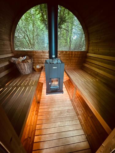 an inside view of a wood stove in a cabin at The Bodos Hut in Lintz Green