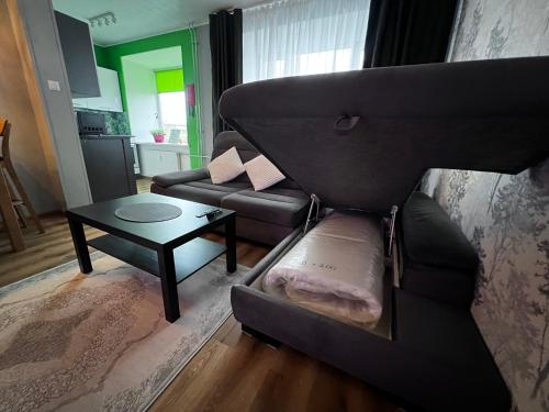 a living room with a couch and a table at Green- Guest Apartment- Tapa in Tapa