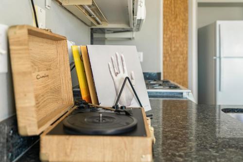 a kitchen counter with a plate and a fork on it at 4 Cayucos Bungalows Steps to Beach Sleeps 16 Pet Friendly in Cayucos