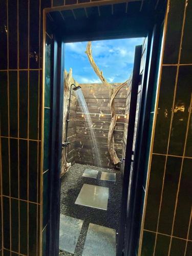 an open door to a room with a view of a window at stargazing grand canyon skylight tiny home venus in Williams