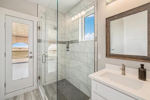 a bathroom with a shower and a sink at Family Retreat W Fireplace & Patio in Hudson