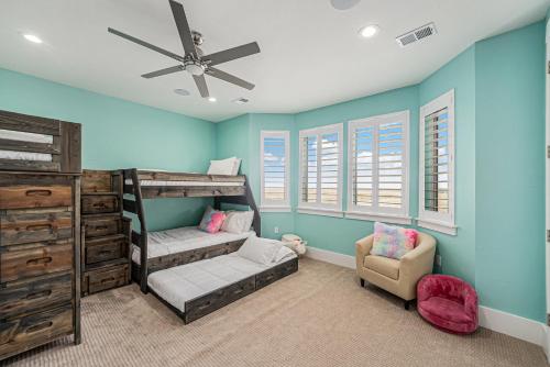 a bedroom with a bunk bed and a chair at Family Retreat W Fireplace & Patio in Hudson